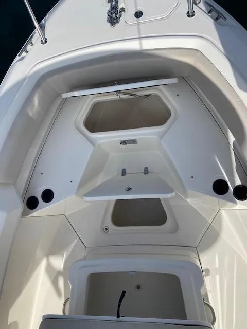 Slide: The Image of 2017 Boston Whaler 150 Montauk boat interior with storage compartments. - 6