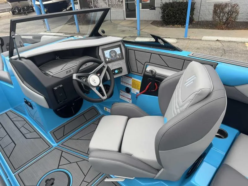 Slide: The Image of 2025 ATX Surf Boats 22 Type-S interior with modern dashboard and steering wheel. - 11