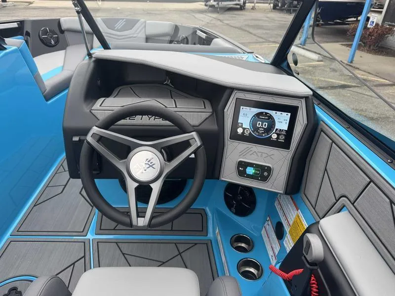 Slide: The Image of 2025 ATX Surf Boats 22 Type-S dashboard with steering wheel and digital display. - 12