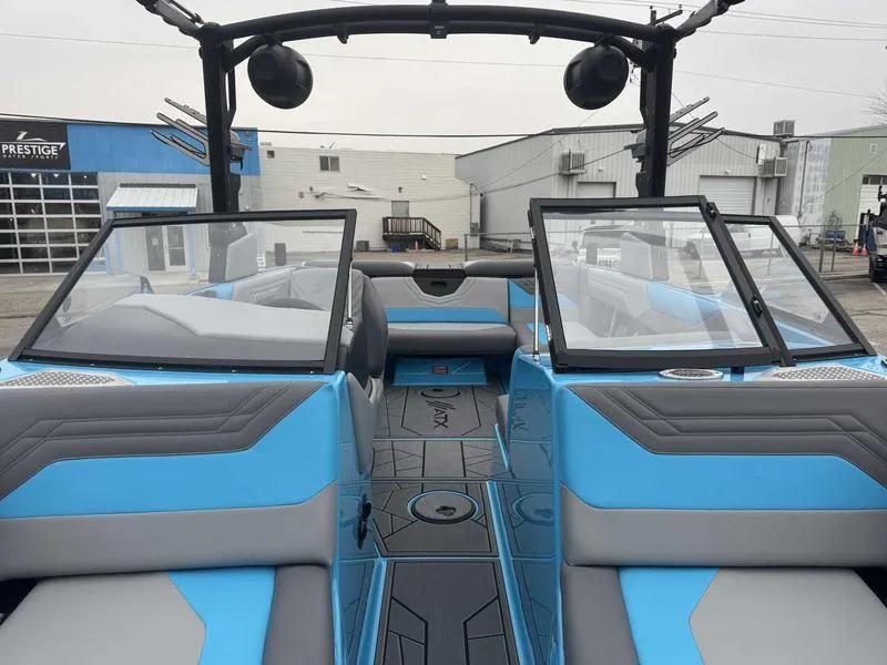 Slide: The Image of 2025 ATX Surf Boats 22 Type-S interior, featuring blue and gray seating with open windshield. - 14