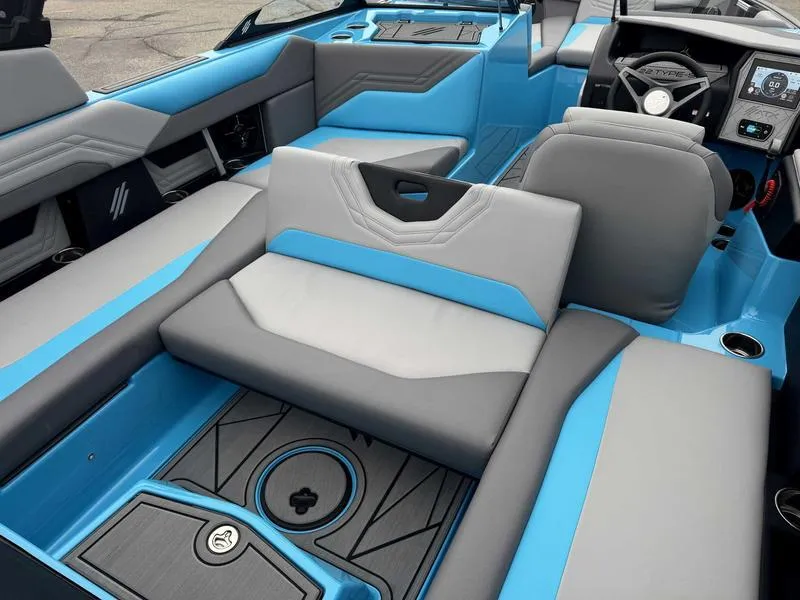 Slide: The Image of 2025 ATX Surf Boats 22 Type-S interior with blue and gray seating. - 16
