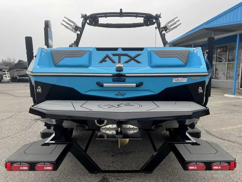 Slide: The Image of 2025 ATX Surf Boats 22 Type-S, blue rear view, parked outdoors. - 7