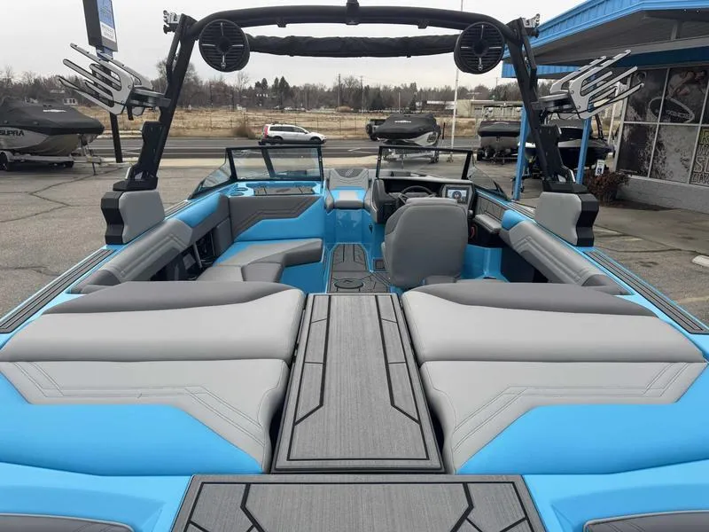 Slide: The Image of 2025 ATX Surf Boats 22 Type-S interior with blue and gray seating, modern design. - 9