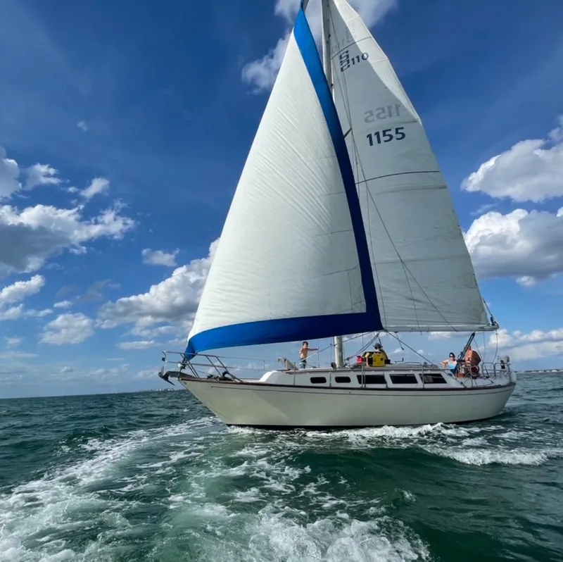 Slide: The Image of Sailing yacht S2 11.0A 1985 on open sea under blue sky. - 3