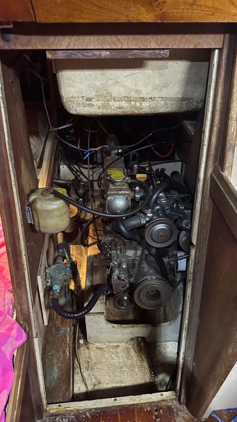 Slide: The Image of 1985 S2 11.0A engine compartment with visible components and wiring. - 7