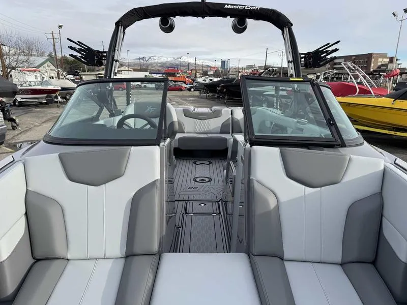 Slide: The Image of 2025 MasterCraft XT22 boat interior with sleek gray and white seating. - 14