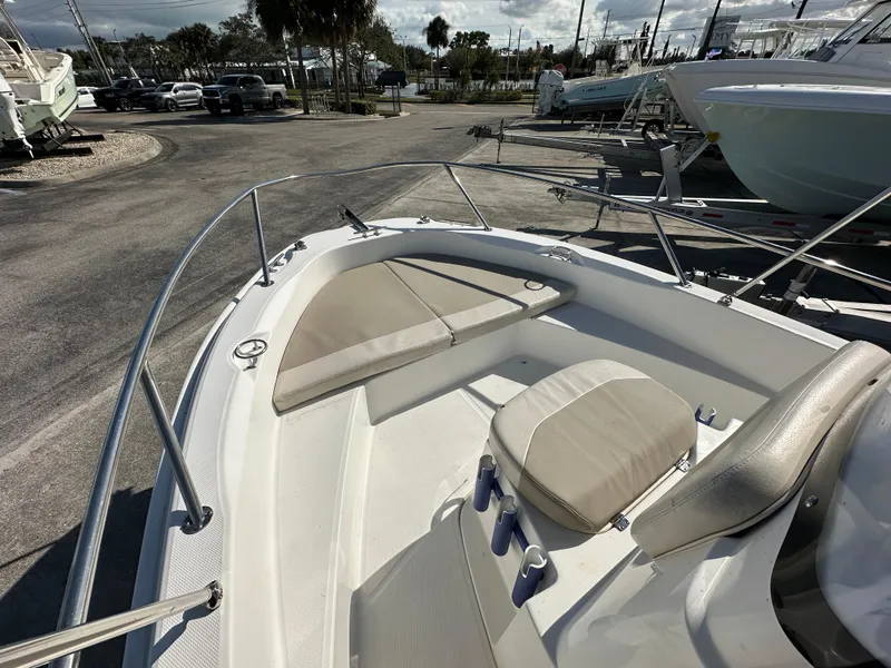 Slide: The Image of 2019 Boston Whaler 180 Dauntless boat interior with seating and railings. - 5