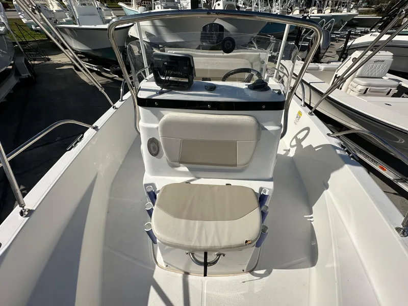 Slide: The Image of 2019 Boston Whaler 180 Dauntless boat interior with steering console and seating. - 7