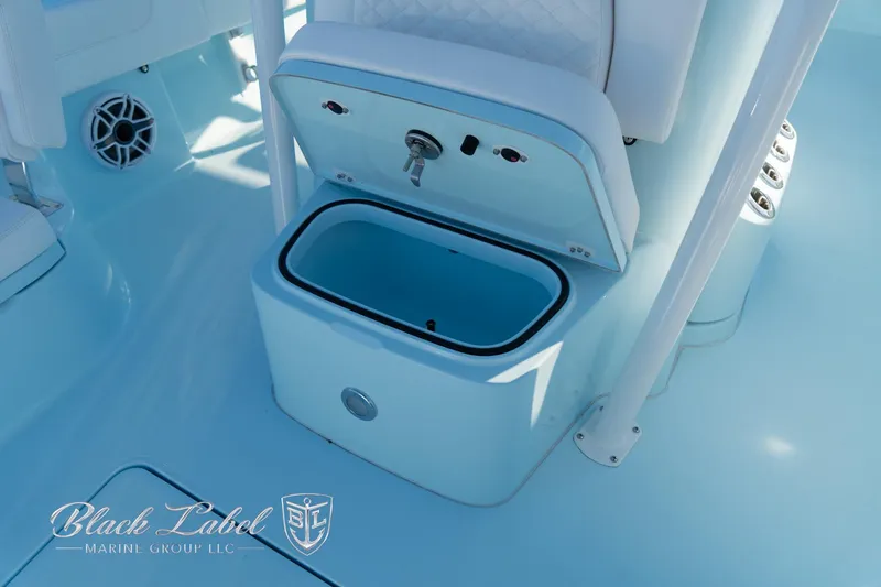 Slide: The Image of 2025 Caymas 28 HB boat interior with storage compartment and seating. - 14