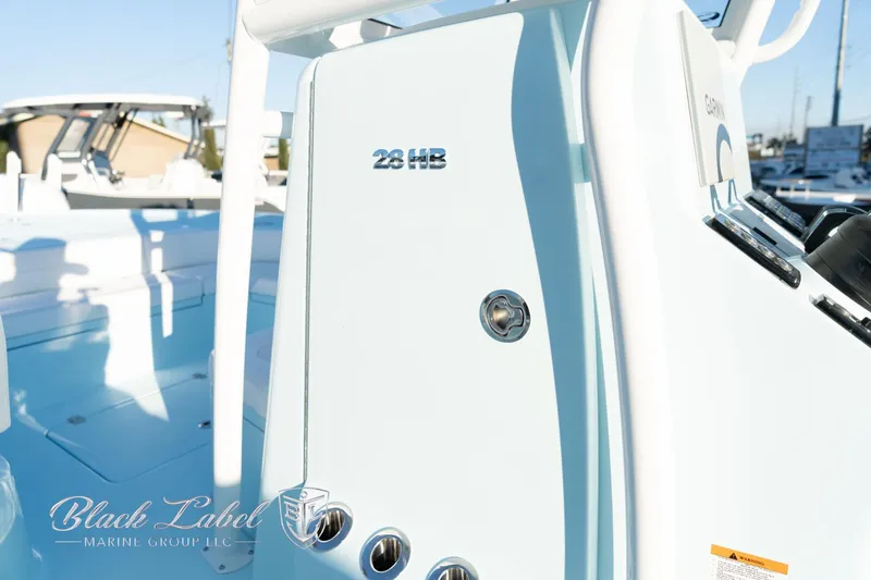 Slide: The Image of 2025 Caymas 28 HB boat console with Black Label Marine Group logo. - 15