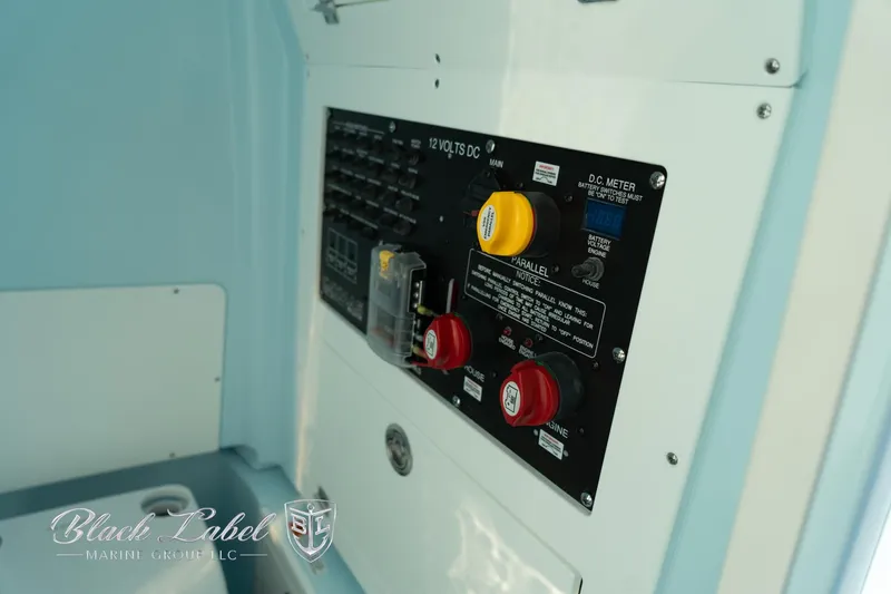 Slide: The Image of Control panel of 2025 Caymas 28 HB boat, featuring electrical switches and meters. - 17