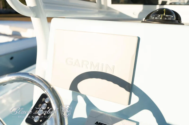 Slide: The Image of 2025 Caymas 28 HB boat dashboard with Garmin navigation system. - 24