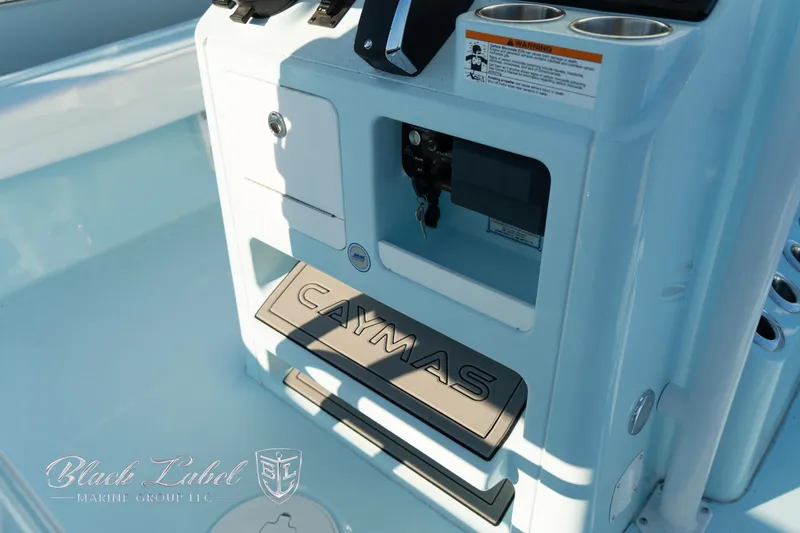 Slide: The Image of 2025 Caymas 28 HB boat console with branding and controls. - 26