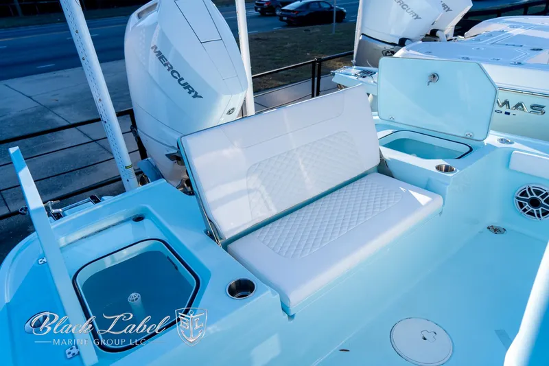 Slide: The Image of 2025 Caymas 28 HB boat interior with seating, storage, and Mercury engines. - 29