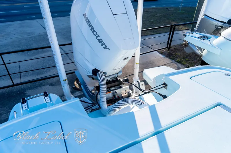Slide: The Image of 2025 Caymas 28 HB boat with Mercury engine, viewed from the deck. - 32