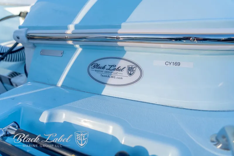 Slide: The Image of 2025 Caymas 28 HB boat with Black Label Marine Group branding. - 34