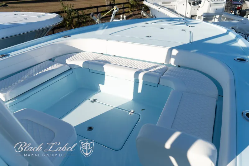 Slide: The Image of 2025 Caymas 28 HB boat interior with seating and storage, by Black Label Marine Group. - 6