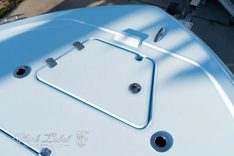 Slide: The Image of 2025 Caymas 28 HB boat deck with storage compartment and fittings. - 8