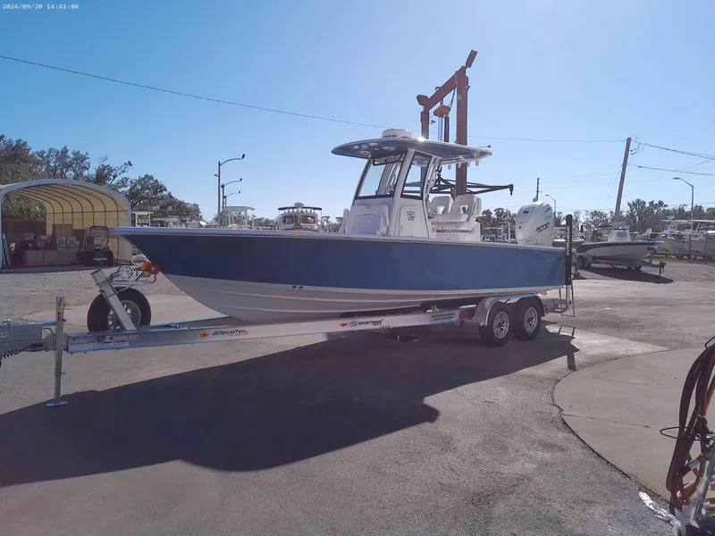 Slide: The Image of 2025 Sportsman Masters 267OE Bay Boat on trailer in sunny outdoor setting. - 3