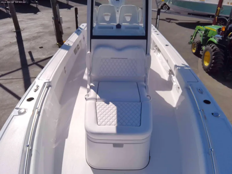Slide: The Image of 2025 Sportsman Masters 267OE Bay Boat interior with cushioned seating and console. - 9