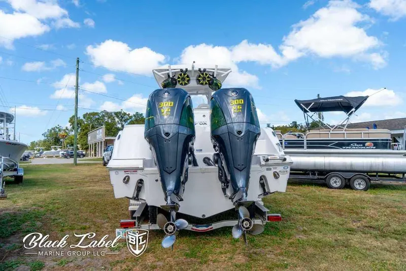 Slide: The Image of 2023 Sea Fox 288 Commander with twin 300 V6 engines, displayed outdoors. - 12