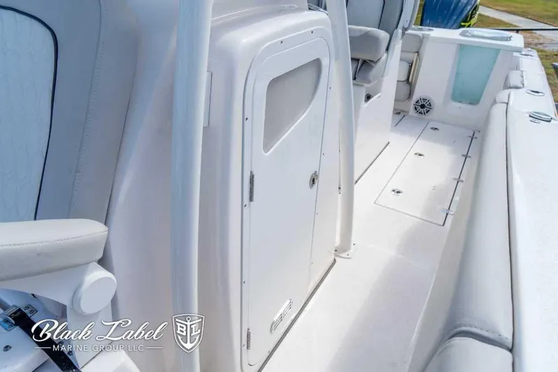 Slide: The Image of 2023 Sea Fox 288 Commander boat interior with seating and storage compartments. - 19