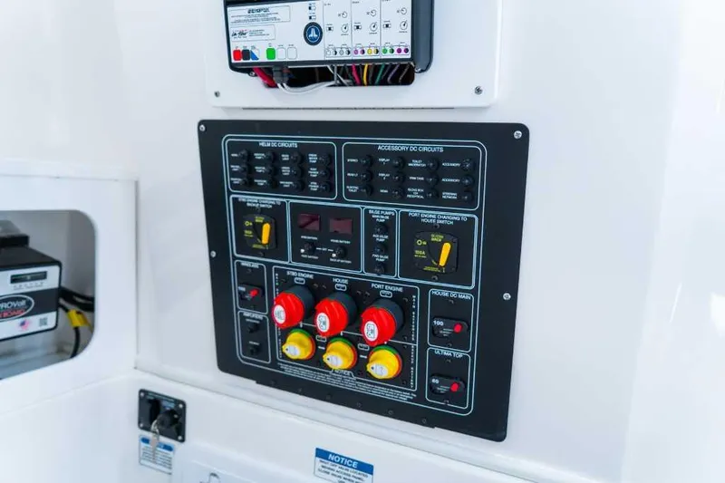 Slide: The Image of Control panel of 2023 Sea Fox 288 Commander boat, featuring various switches and circuit breakers. - 2