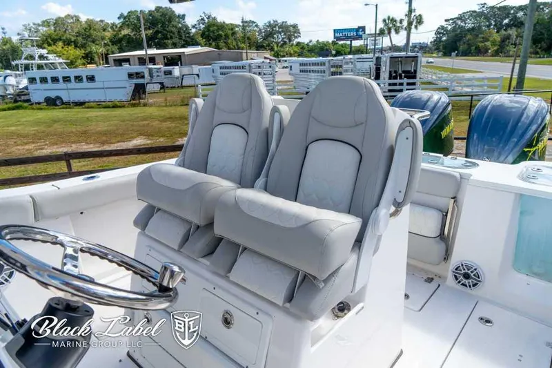 Slide: The Image of 2023 Sea Fox 288 Commander boat with dual captain's chairs and steering wheel. - 20