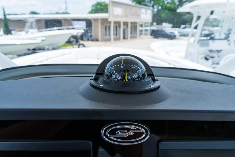 Slide: The Image of 2023 Sea Fox 288 Commander dashboard with compass and logo. - 3