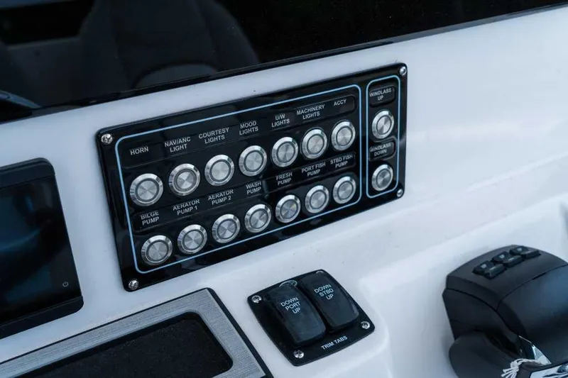 Slide: The Image of Control panel of 2023 Sea Fox 288 Commander boat with labeled switches. - 5