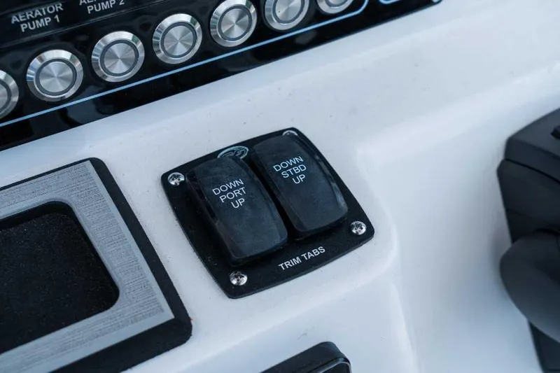 Slide: The Image of Trim tab controls on 2023 Sea Fox 288 Commander boat dashboard. - 7