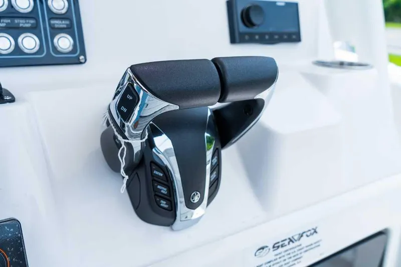 Slide: The Image of Close-up of 2023 Sea Fox 288 Commander boat throttle controls. - 8