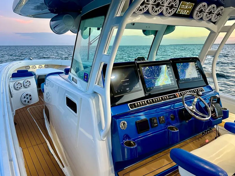 Slide: The Image of 2018 HCB 53 Suenos RXV boat interior with advanced navigation system and ocean view. - 2