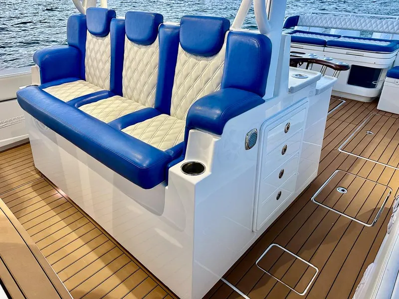 Slide: The Image of Luxurious seating on 2018 HCB 53 Suenos RXV boat with blue and white upholstery. - 6