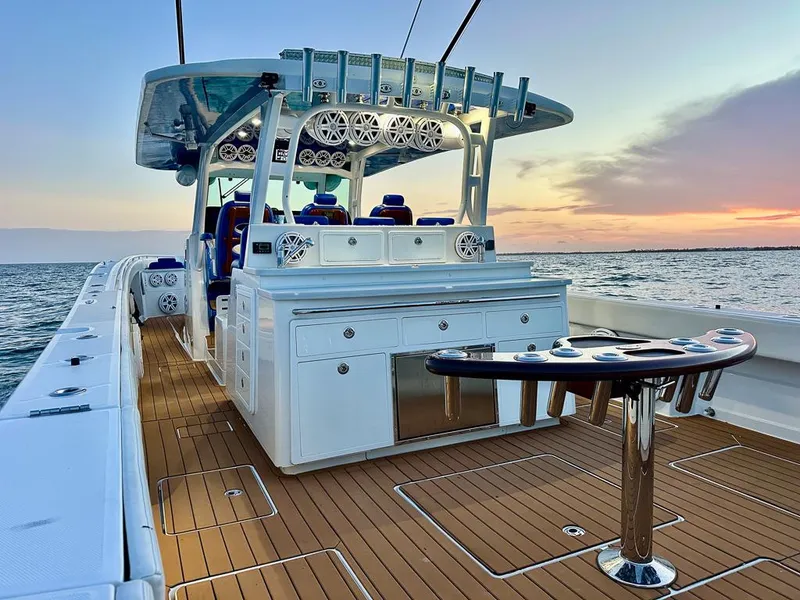 Slide: The Image of 2018 HCB 53 Suenos RXV boat with teak deck, ocean view at sunset. - 8