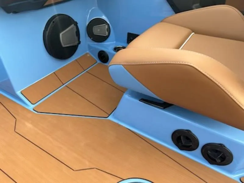 Slide: The Image of 2025 Axis T220 interior with tan seating and blue accents, featuring modern speaker system. - 15