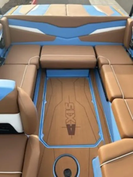 Slide: The Image of 2025 Axis T220 boat interior with brown and blue seating. - 17