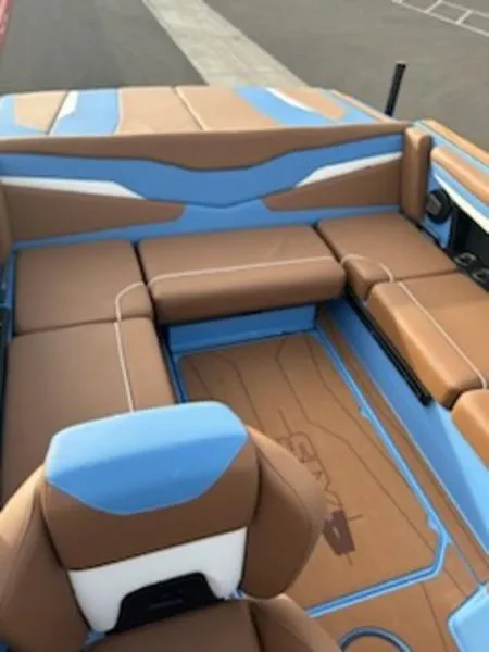 Slide: The Image of 2025 Axis T220 boat interior with brown and blue seating. - 18