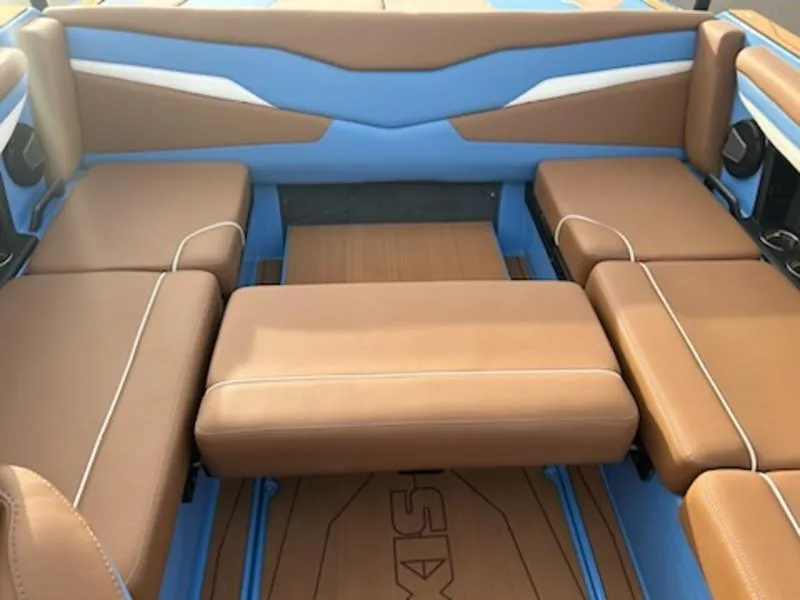 Slide: The Image of 2025 Axis T220 boat interior with brown and blue seating arrangement. - 20