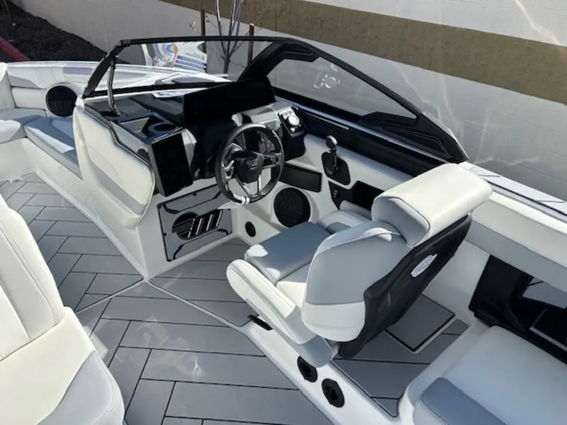 Slide: The Image of 2025 Malibu 26 LSV boat interior with sleek design and modern controls. - 13