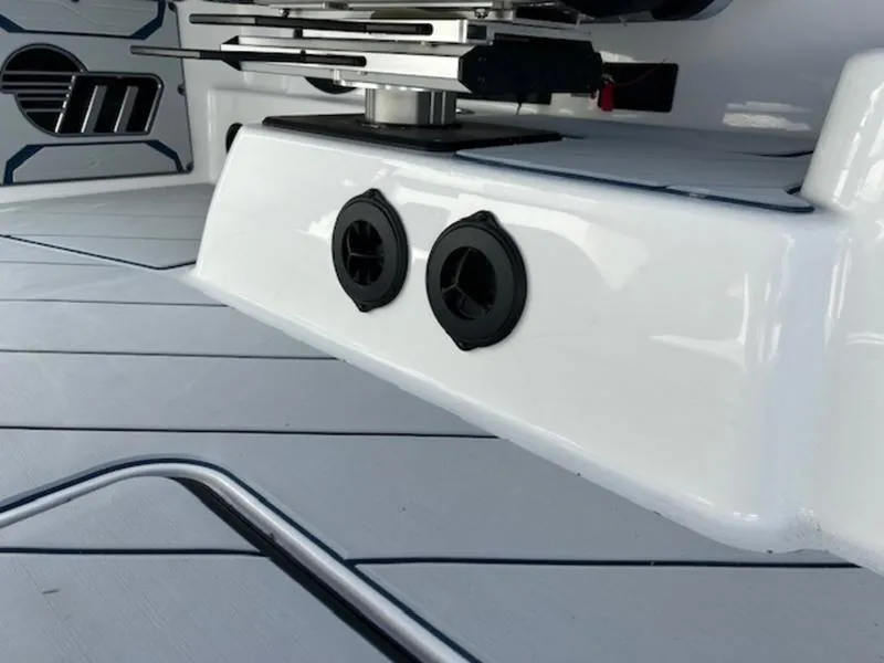 Slide: The Image of 2025 Malibu 26 LSV boat interior with sleek white design and modern fixtures. - 15