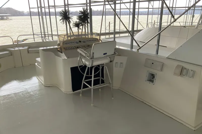 Slide: The Image of 2004 Sumerset 18 x 87 houseboat helm with lake view and seating. - 13