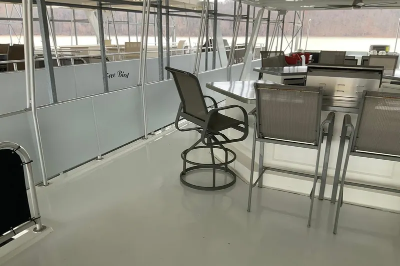 Slide: The Image of Spacious deck of 2004 Sumerset 18 x 87 houseboat with seating and tables. - 16