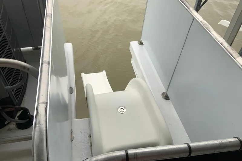 Slide: The Image of 2004 Sumerset 18 x 87 houseboat slide leading to water. - 23