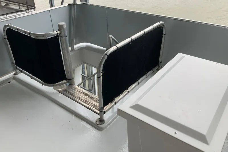 Slide: The Image of 2004 Sumerset 18 x 87 houseboat deck with railing and storage compartment. - 25