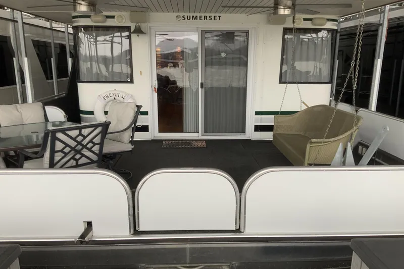 Slide: The Image of 2004 Sumerset 18 x 87 houseboat with outdoor seating and swing. - 3