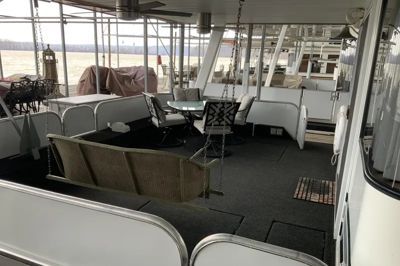 Slide: The Image of 2004 Sumerset 18 x 87 houseboat interior with seating area and river view. - 4