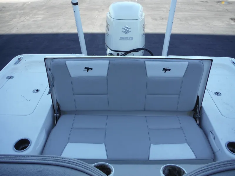 Slide: The Image of 2018 Sea Pro 248 Bay boat with Suzuki engine, featuring comfortable rear seating. - 16