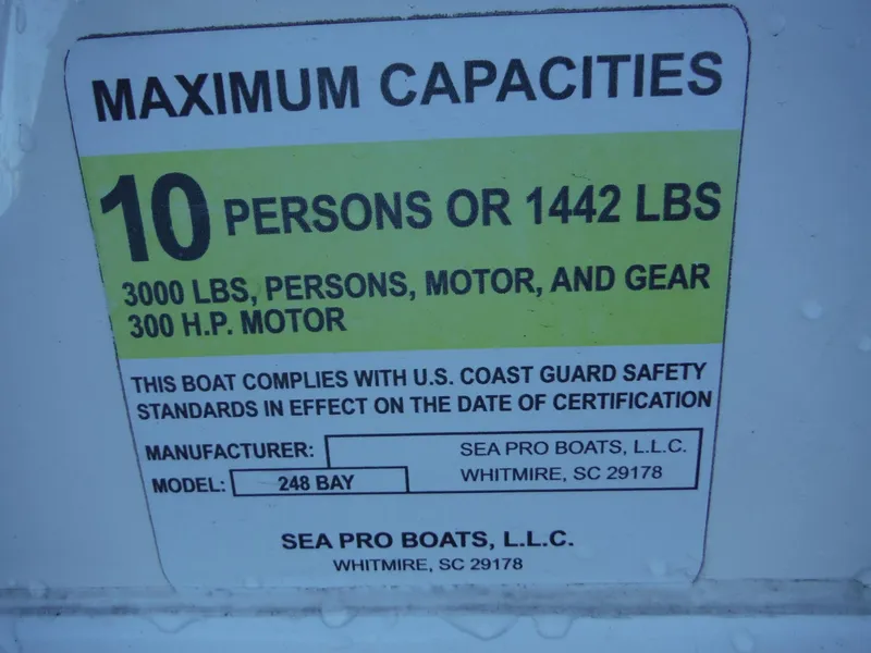 Slide: The Image of Sea Pro 248 Bay 2018 capacity label: 10 persons or 1442 lbs, 3000 lbs total. - 22