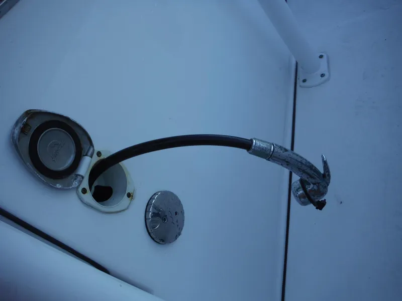 Slide: The Image of Fuel cap and hose on a 2018 Sea Pro 248 Bay boat. - 24